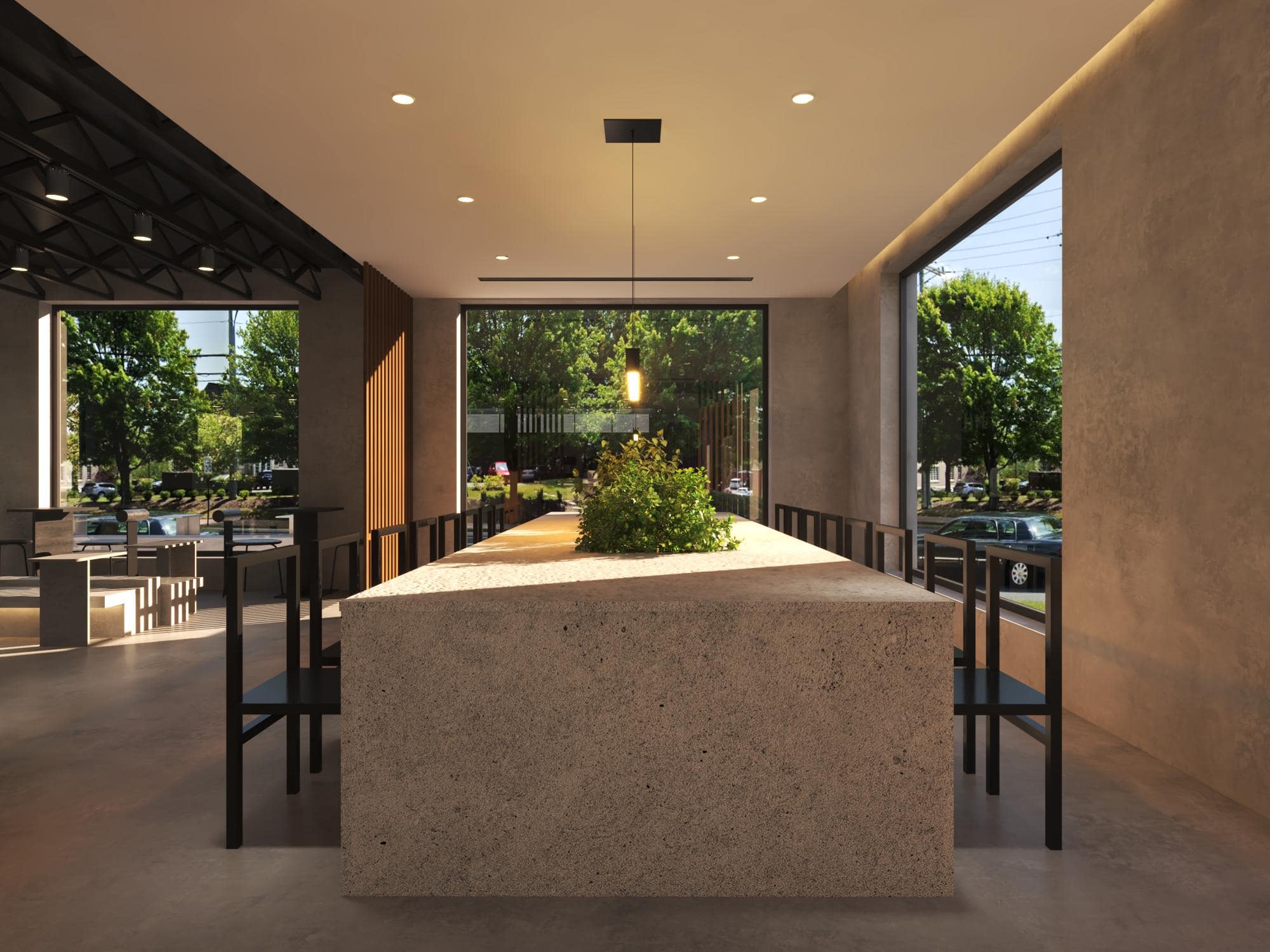 A modern coffee shop with a long table and chairs